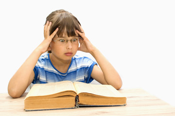 Cute teenager with books on white background