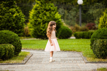 Girl running along the alley