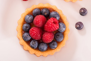 Tartlets with forest fruits. 
