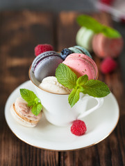 Assorted colofrul macarons with fresh berries