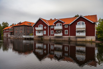 Obraz premium Old tow of Falun with traditional red Swedish wooden dwellings. Dalarna County, Sweden.