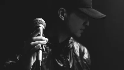 asian male singer hands on microphone, black and white © princeoflove