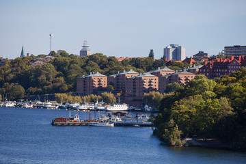 Naklejka premium Small private boats along canal in Stockholm. View from the bridge