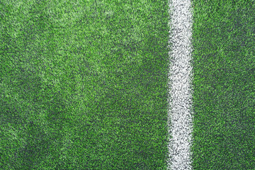 surface of Artificial turf with White corner line on the green football/soccer field from top view for background