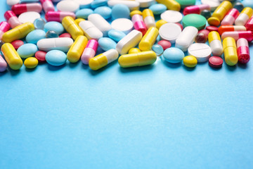 Fototapeta na wymiar Different pills on color background