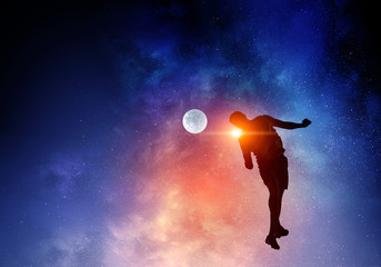 Naklejka premium Soccer player with ball outdoors