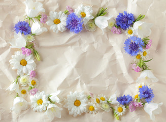 Fototapeta na wymiar Beautiful floral composition with chamomile flowers on paper background