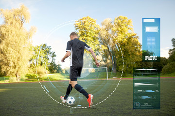 soccer player playing with ball on football field
