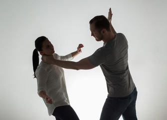 couple having fight and man choking woman