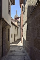 Stone narrow alley in Guimaraes, Portugal