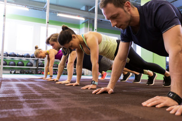 group of people exercising in gym