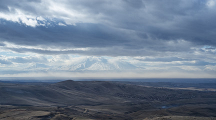 Mountain landscape and sky covered with clouds, in Armenia.