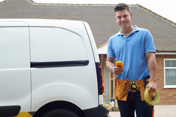 Portrait Of Electrician With Van Outside House © highwaystarz