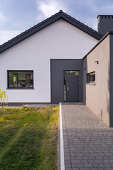 House with cobblestone entry pathway