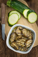Zucchinis (grilled) on wooden background (selective focus)