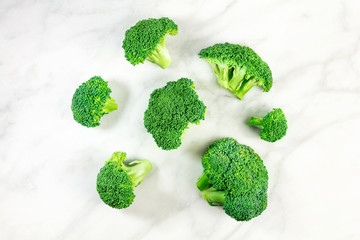 Three vibrant green broccoli florets with copyspace