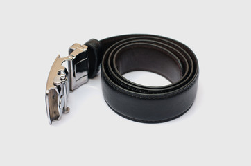 black men's belt roll up isolated on white.