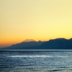 high mountains over sunset sky