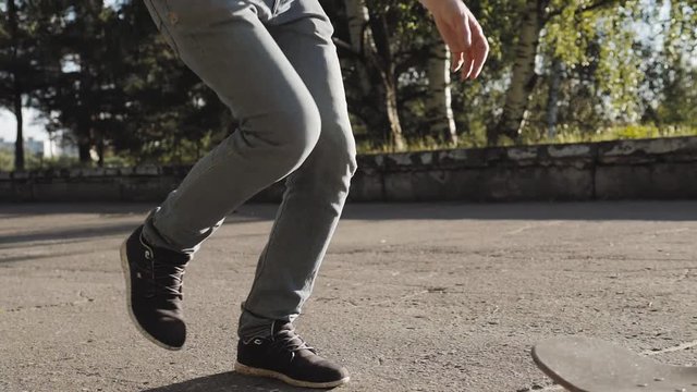 Boy Skateboarding Jump Lifestyle Hipster Concept, flip ollie trick, close up riding on longboard