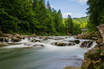 background landscape with waterfall in Yaremche vilage in Ukraine