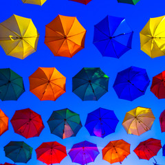 Umbrellas flying in the sky