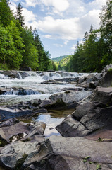 background landscape with waterfall in Yaremche vilage in Ukraine