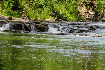 background landscape with waterfall in Yaremche vilage in Ukraine