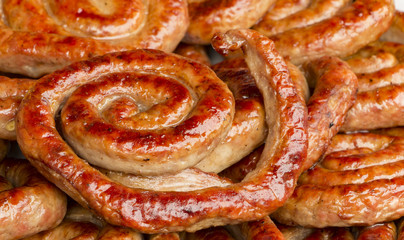 Traditional food. Smoked sausages meat hanging in domestic smokehouse
