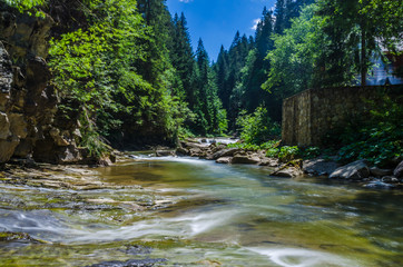 background landscape with waterfall in Yaremche vilage in Ukraine