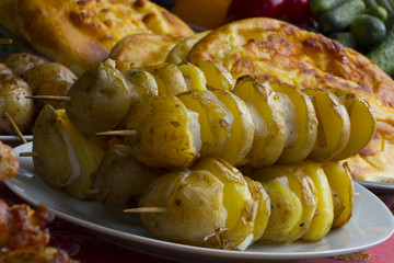 Grilled vegetables and chicken on wooden table overhead shot