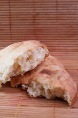 Pieces of fresh pita bread in the home kitchen