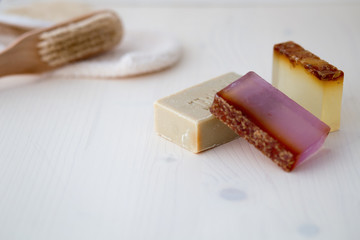 Natural handmade soap bars made with herbs and essential oils with body care tools for treatment and relax bath