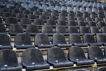 Fototapeta premium Empty tribune with black seat on soccer sdadion