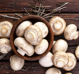 Mushrooms heap on wood background. Top view.