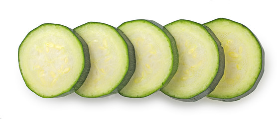Slices of zucchini isolated on white background, top view, close up.