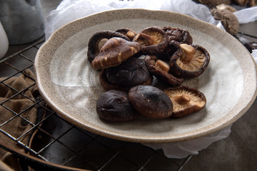 Dried shiitake mushroom on table background