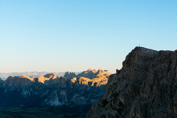 Fototapeta premium Sunrise at the top of dolomite mountain peaks