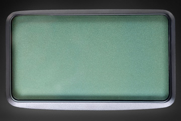 Green LCD screen in black plastic frame
