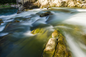 background landscape with waterfall in Yaremche vilage in Ukraine