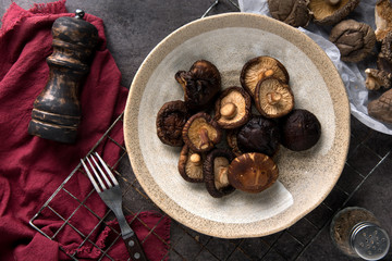 Dried shiitake mushroom on table background