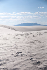Footprints in white sands desert