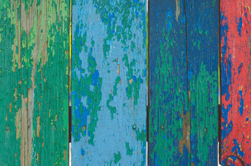Fototapeta na wymiar Wooden multicolored background with old paint