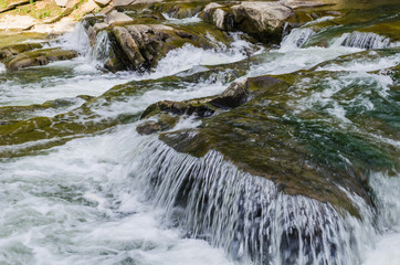 background landscape with waterfall in Yaremche vilage in Ukraine