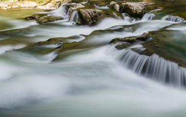 background landscape with waterfall in Yaremche vilage in Ukraine