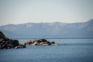 Kayaking on lake tahoe, california with moutains in background