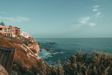 House on a cliff by the ocean with foreground, newport beach, inspiration point, corona del mar