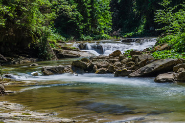 background landscape with waterfall in Yaremche vilage in Ukraine