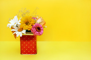 Bouquet of flowers on a yellow background