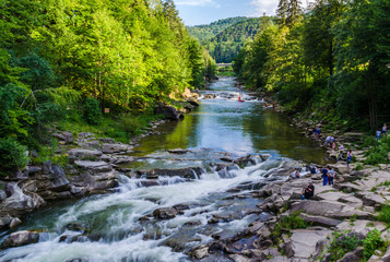 background landscape with waterfall in Yaremche vilage in Ukraine