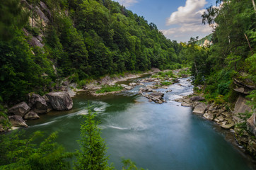 background landscape with waterfall in Yaremche vilage in Ukraine